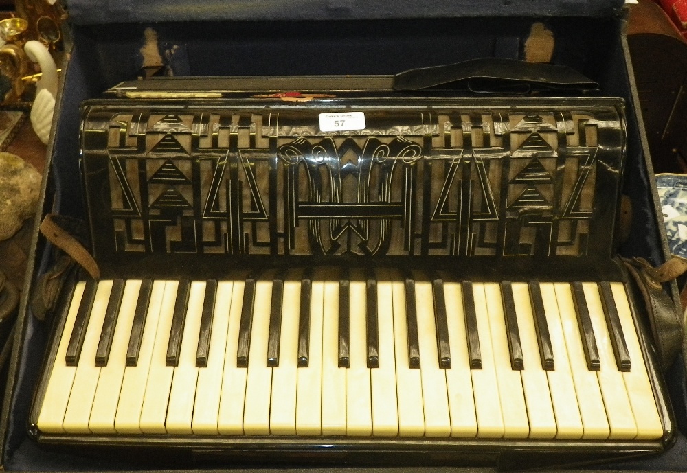 An `Estrella Italia` piano accordion no. 1012 in carrying case