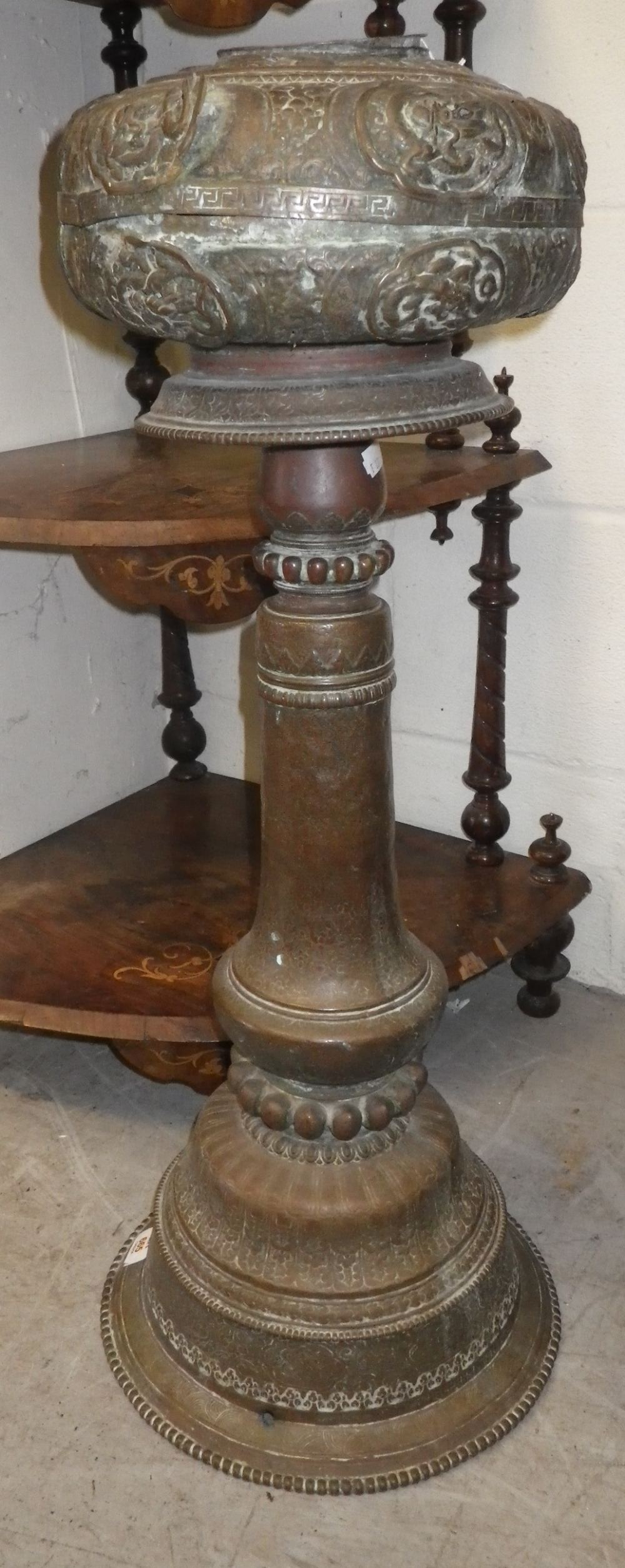 An Indian or Tibetan floor standing metal censer on a tapering stem and stepped base, late 19th/