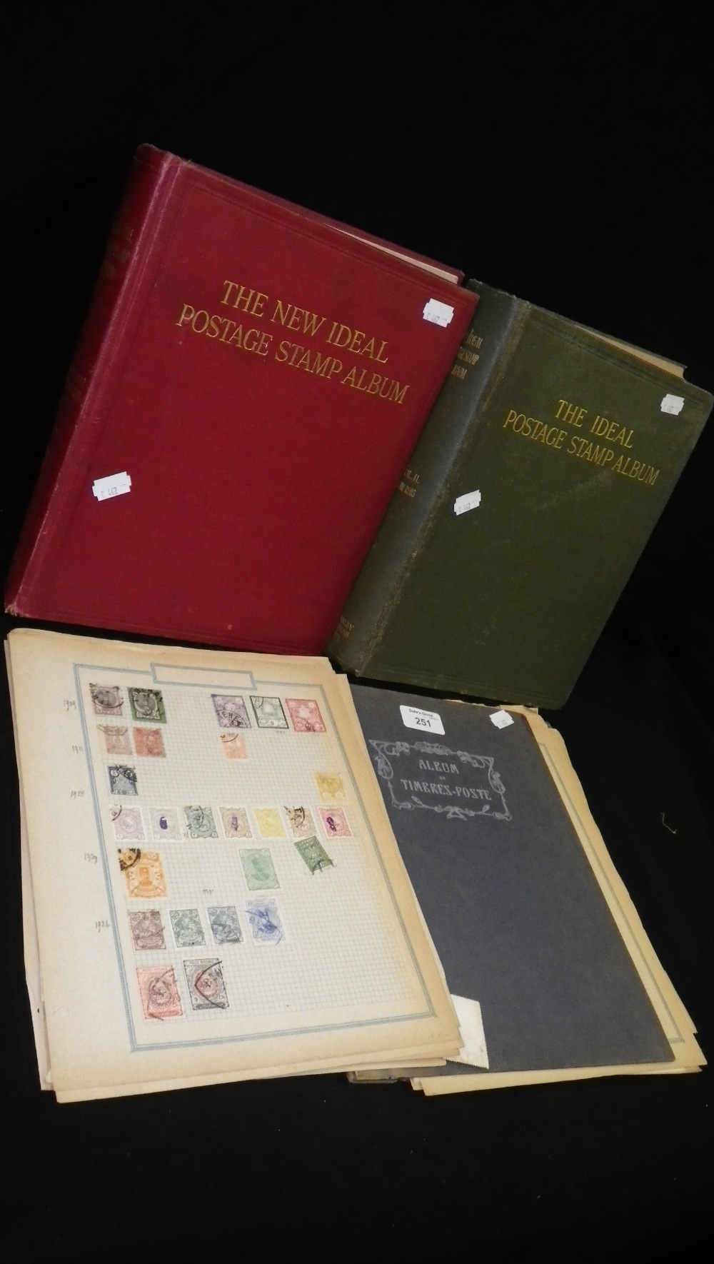 A small collection of stamp albums and a quantity of loose stamps.