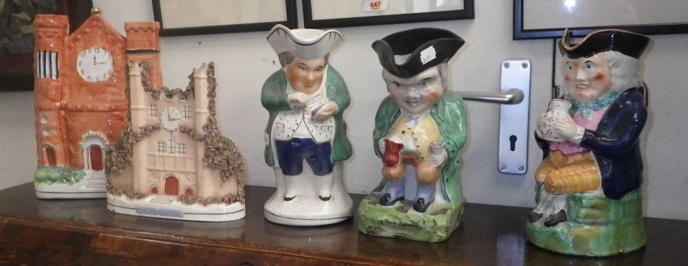 A Staffordshire Toby jug and two others similar, a `Trinity College` spill vase and another similar.