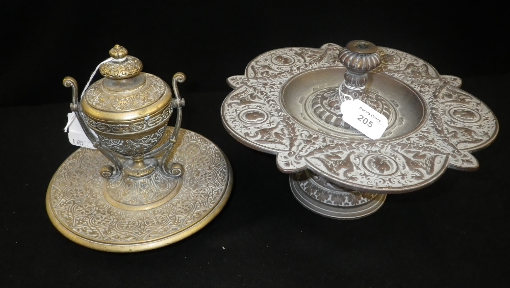 An Italianate style cast table dish, decorated with winged beasts and heads, and a similar gilt