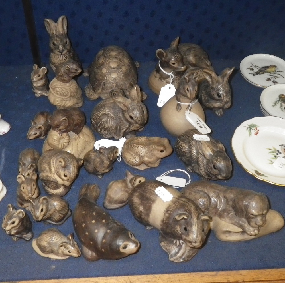 A collection of Poole pottery animal ornaments including a tortoise, a seal and others.