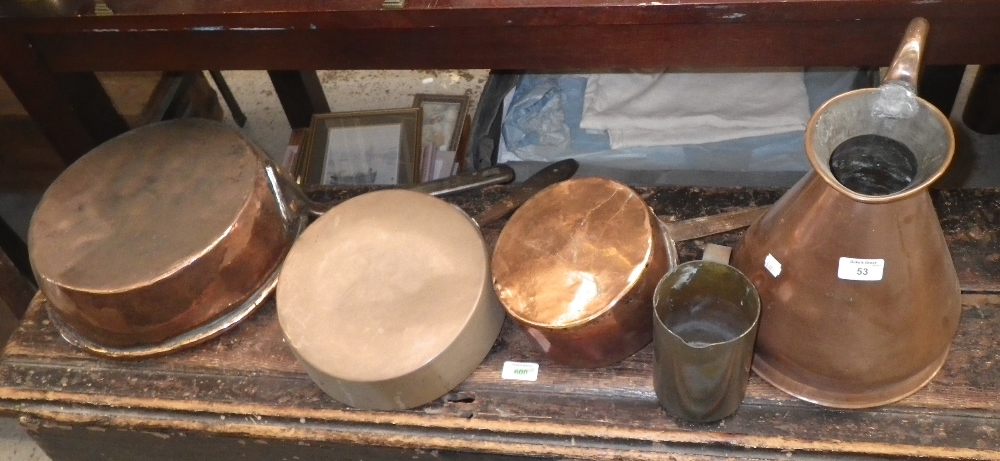 A collection of Victorian copper saucepans and similar metalware.