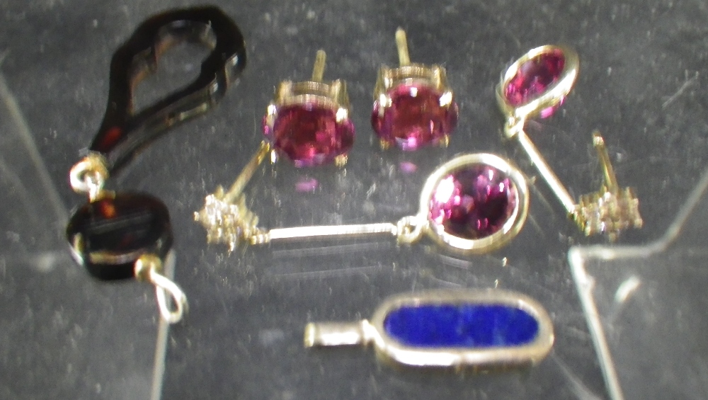 A pair of garnet and white stone cluster drop earrings, a pair of similar ear studs and other