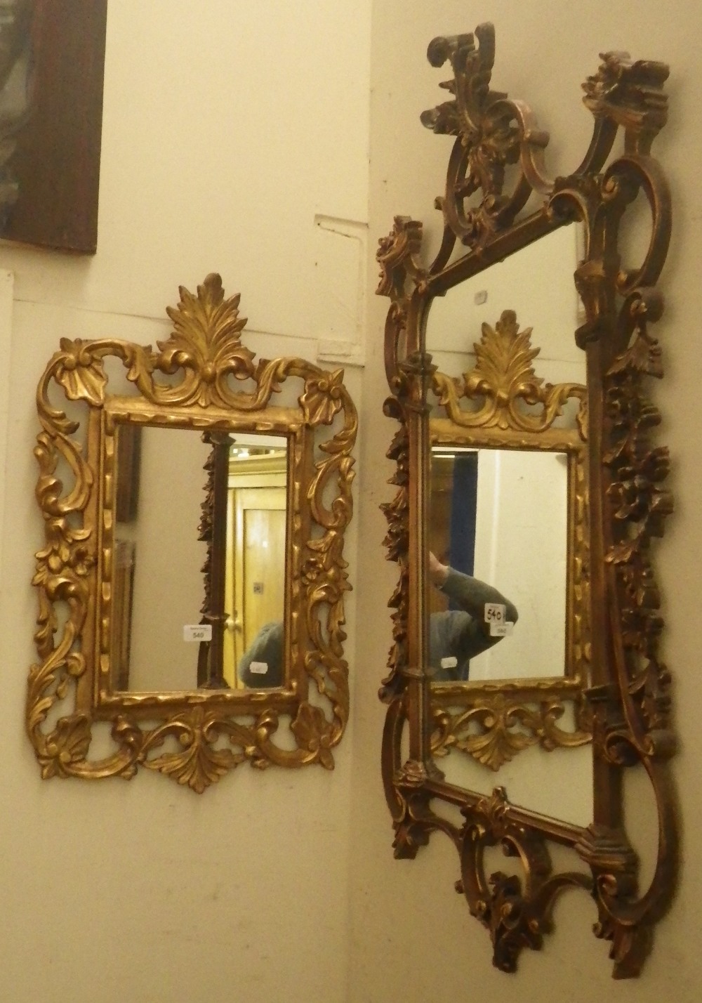 A wall mirror in a Florentine style giltwood frame and two others similar.