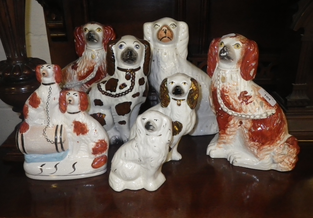 A collection of Staffordshire dogs.