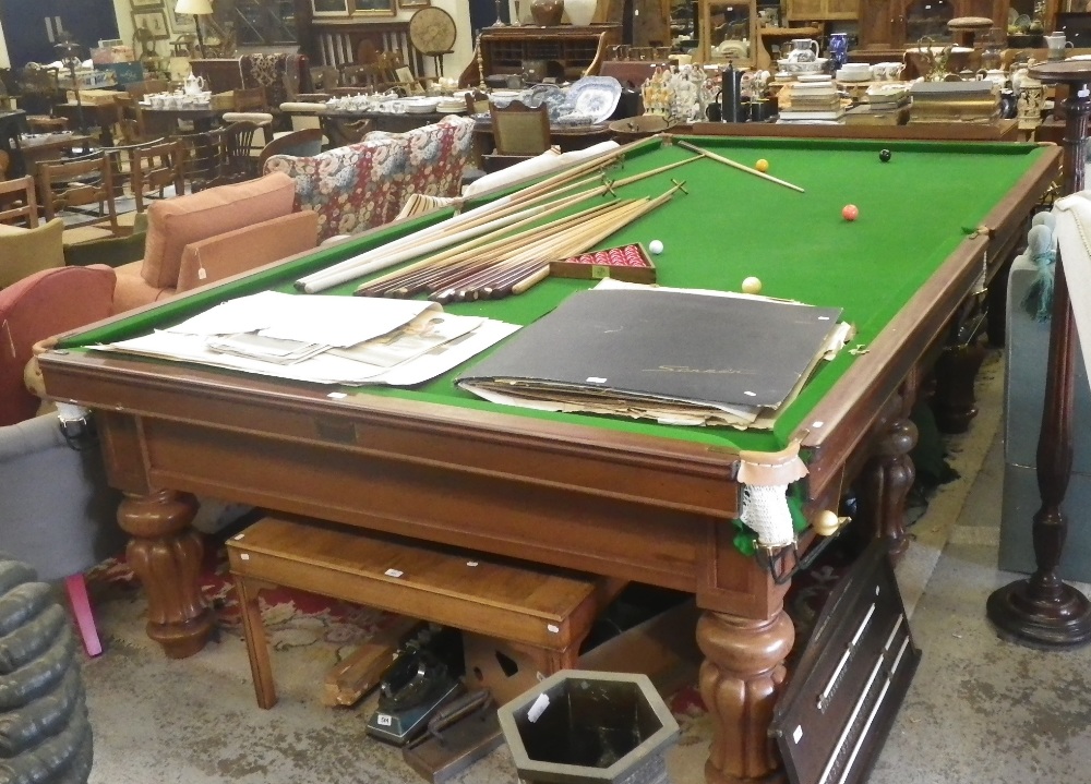 A full size snooker table by `Thurston & Co Ltd` with stand fast cushions. Together with scoreboard,