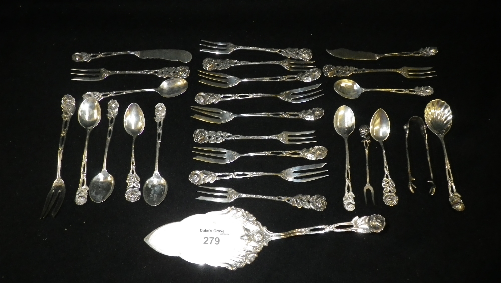 A Continental silver suite of cake forks and teaspoons with flower terminals and a cake slice