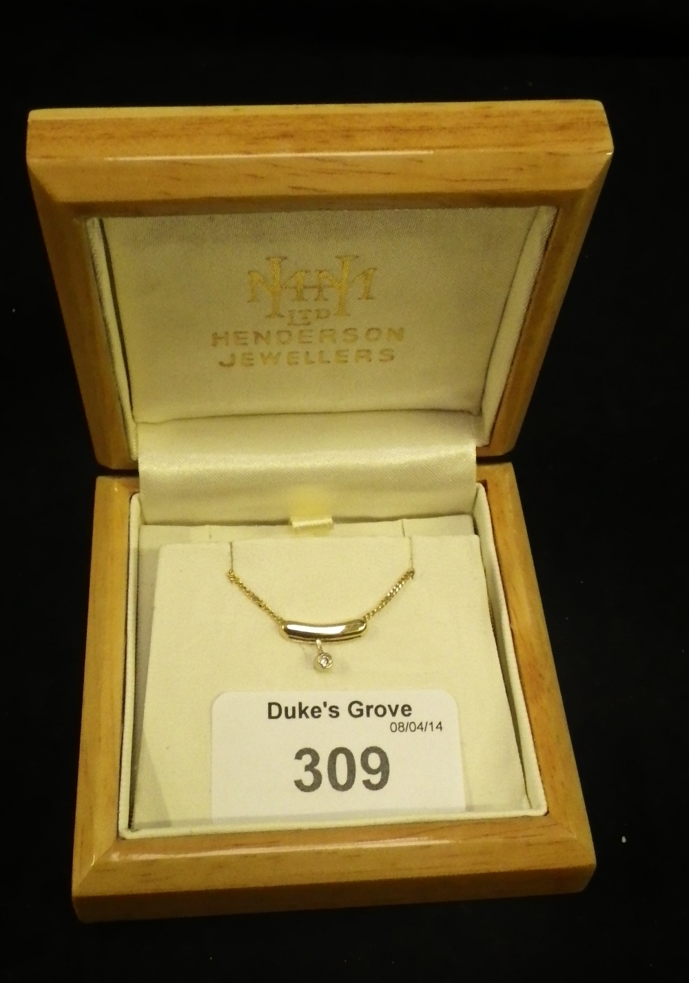 A 14ct `Lucky Bean` pendant and chain set with a diamond.