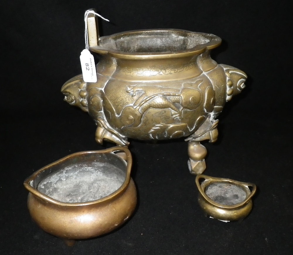 A Chinese brass censer (marks to the base) and two similar.