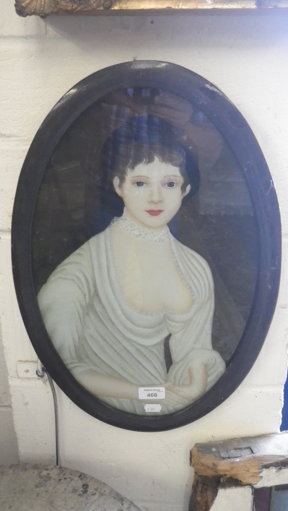 A 19th century reverse painting on glass painting of a young lady, possibly Chinese.