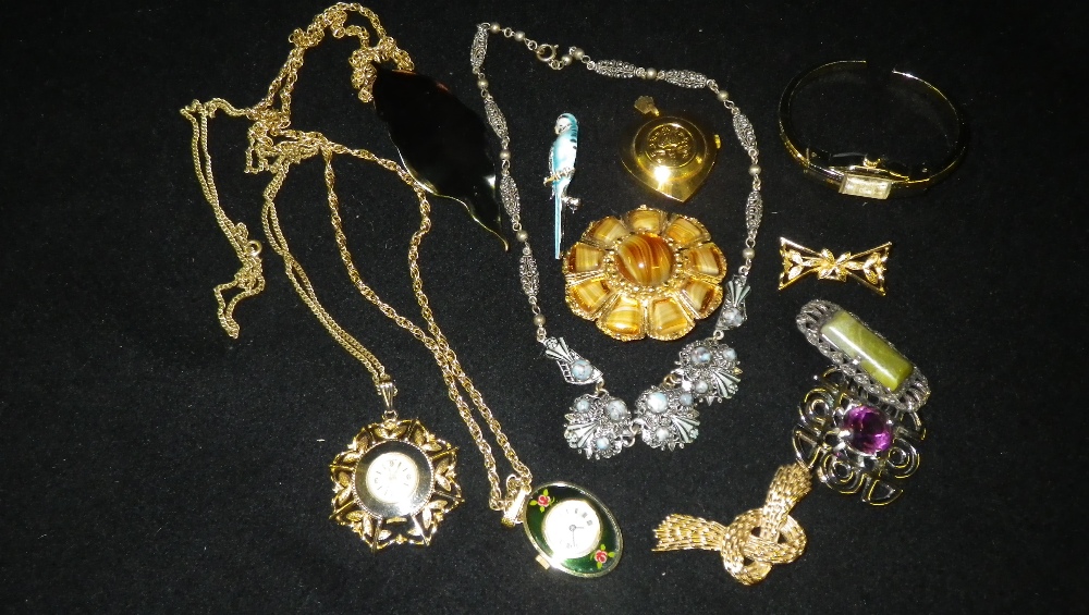 A quantity of mixed costume jewellery including three pendant watches.