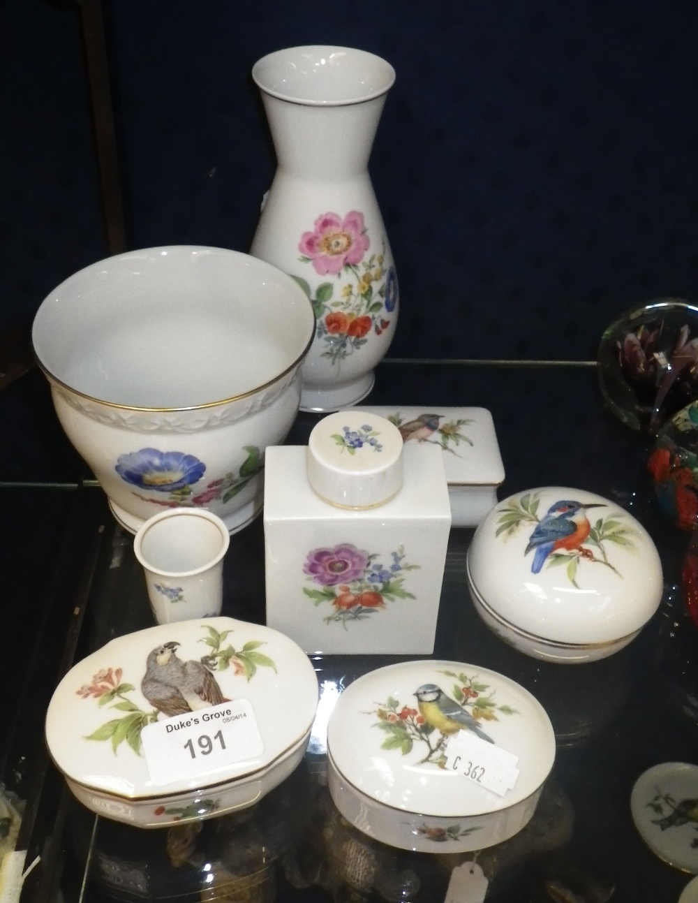 A small collection of Meissen lidded jars, vases and similar items with floral and bird decoration.