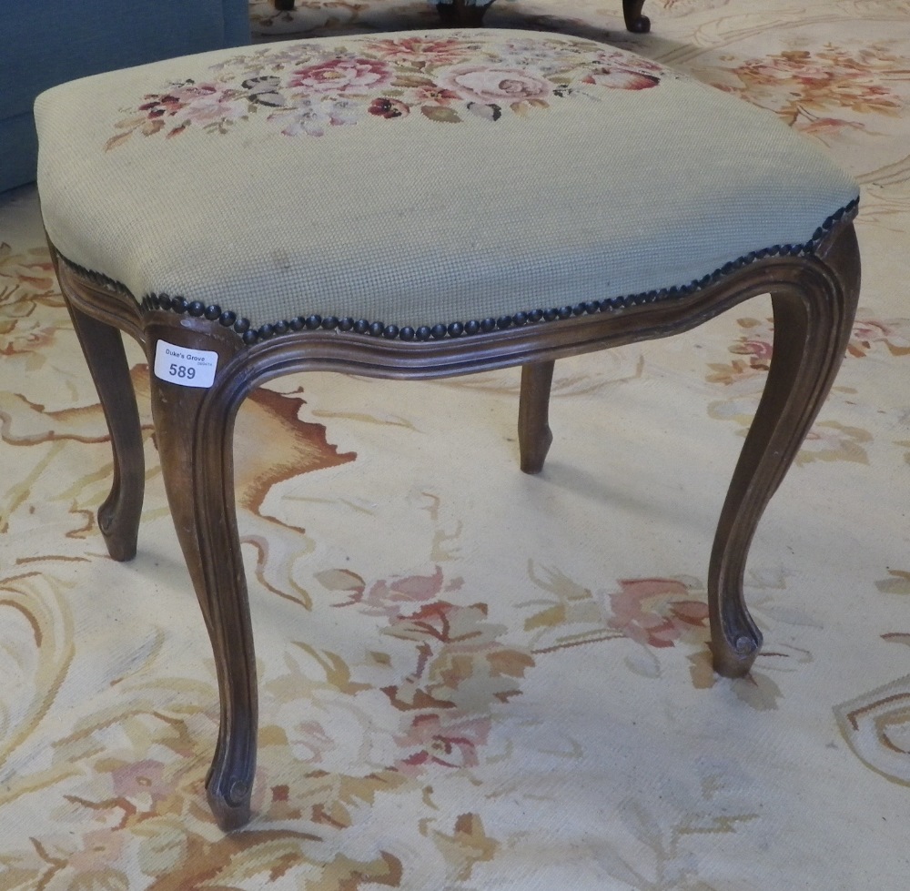 A beech framed Louis XV style stool with needlework top.