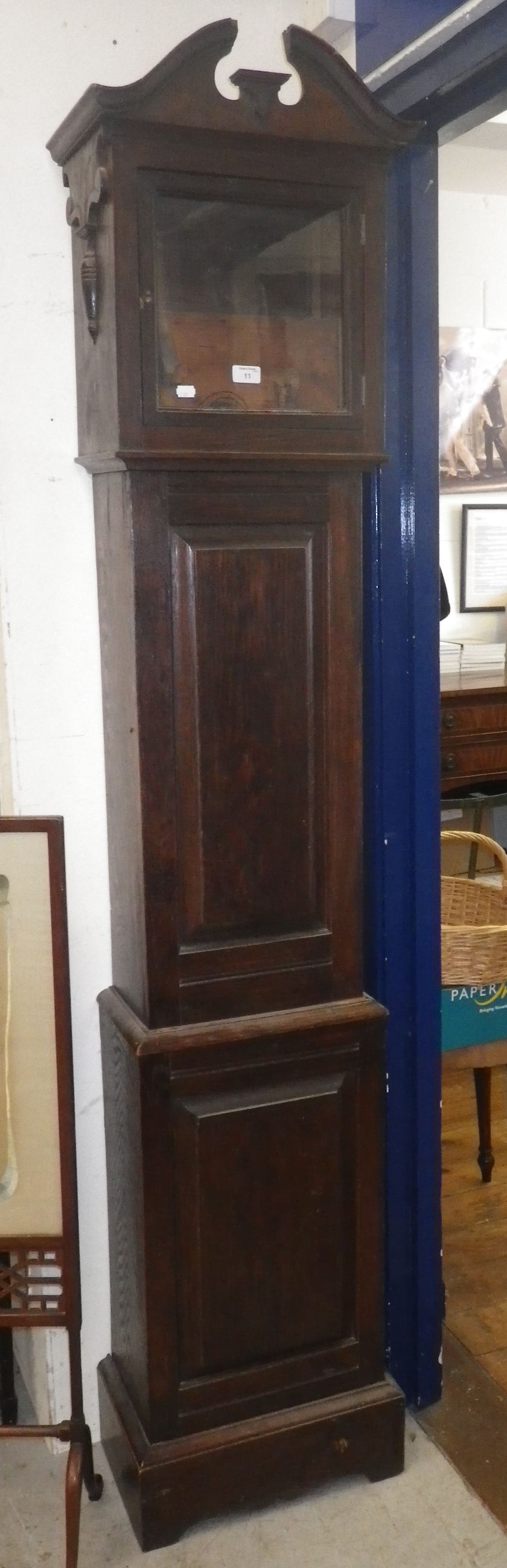 An oak grandfather clock case.