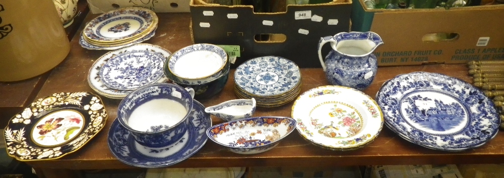 A Victorian blue and white plate, a collection of dessert plates and similar ceramics.