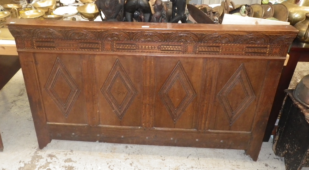 A section of 18th century oak panelling with parquetry decoration .