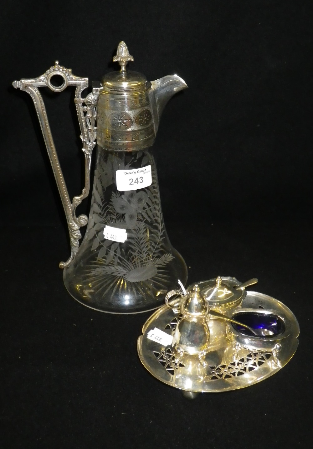 A plated condiment set and a similarly mounted claret jug.