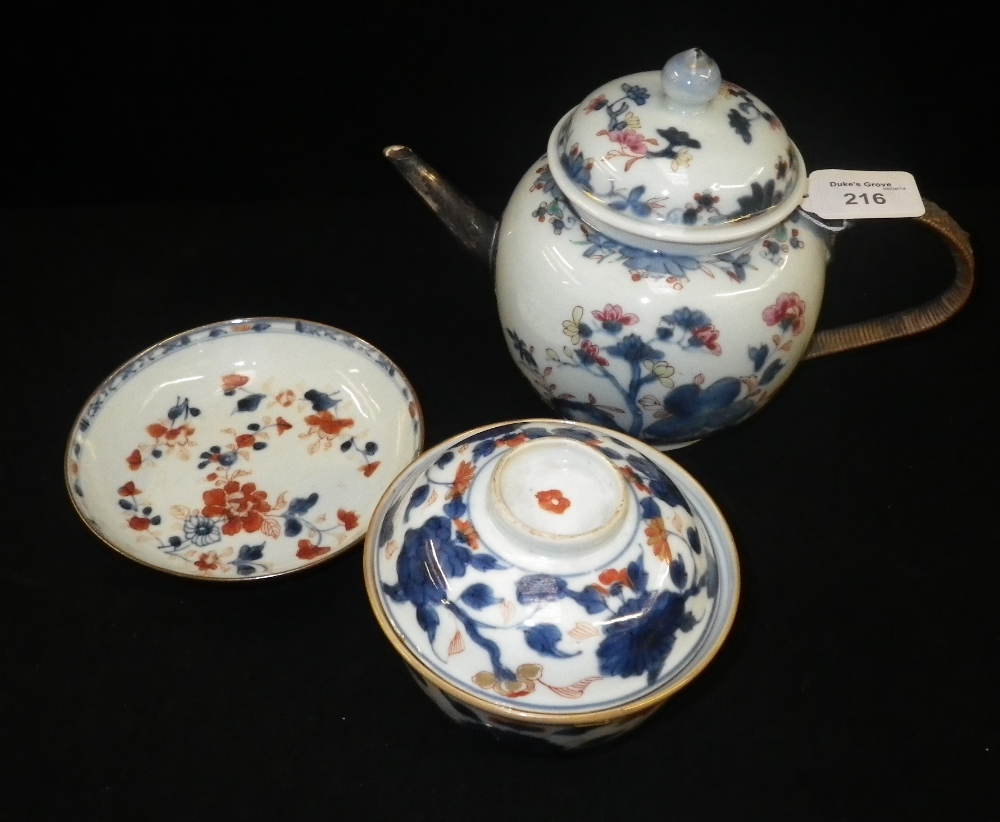 A Chinese `Imari` teapot and two similar items.