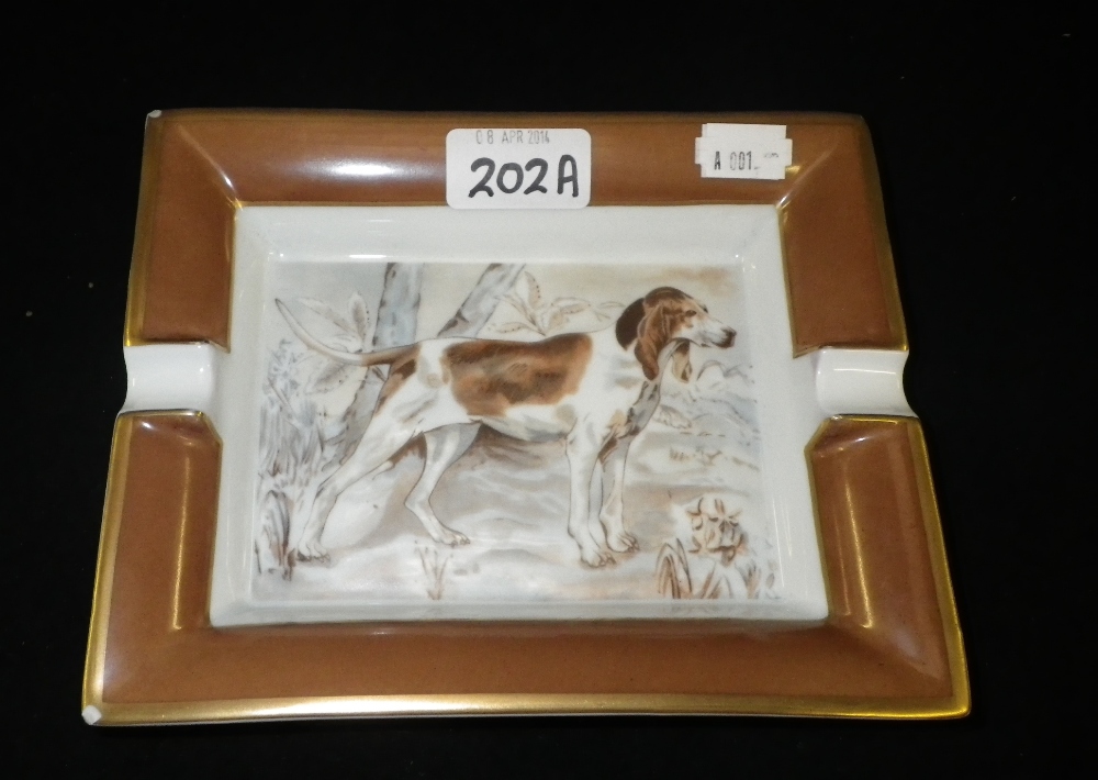 An ashtray decorated with a Gun Dog, signed `Hermes, Paris`.
