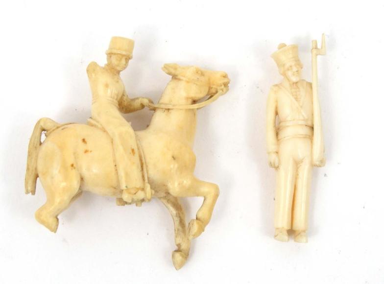 Ivory carved rearing horseman, together with a soldier, the larger 6cm high : FOR CONDITION REPORTS