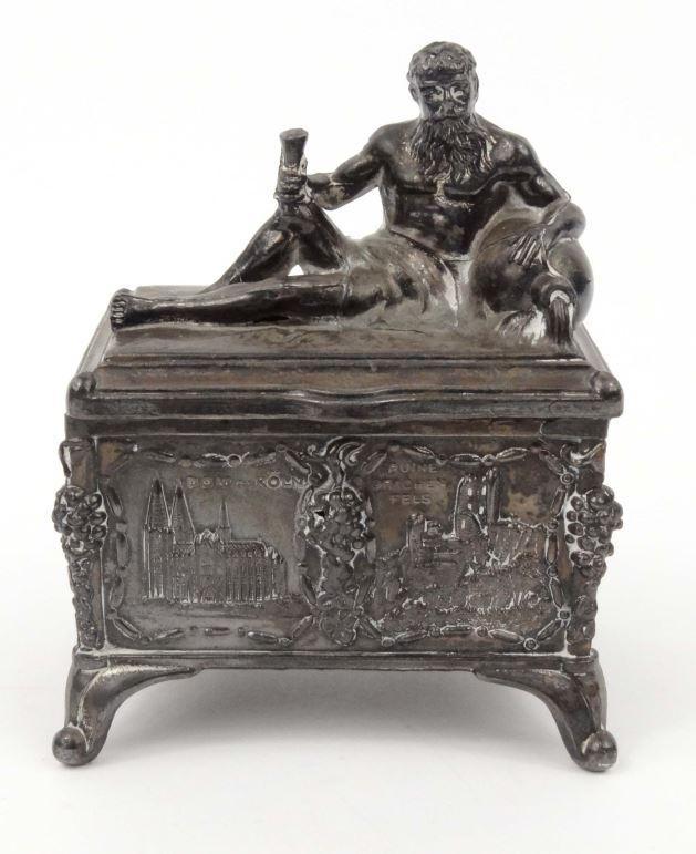 Continental German spelter casket with  atlas lid and scenes of buildings to the exterior, 12cm