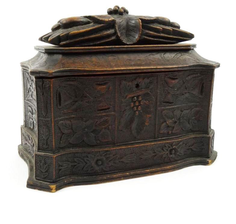 Black Forest wooden casket carved with fruit and flowers, approximately 22cm high x 29cm wide : FOR