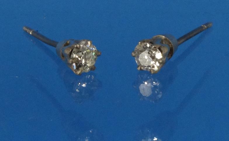 Pair of solitaire diamond earrings, each ¼ct of diamonds : FOR CONDITION REPORTS AND LIVE BIDDING