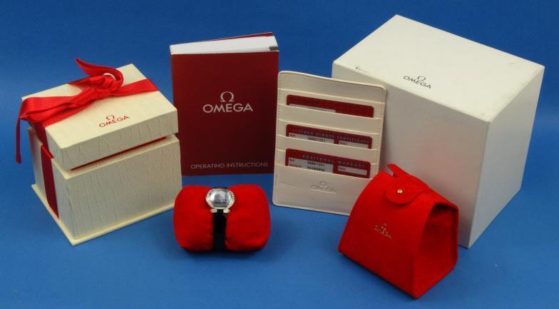 Boxed Omega lady`s 18ct gold wristwatch set with diamonds complete with paperwork and international