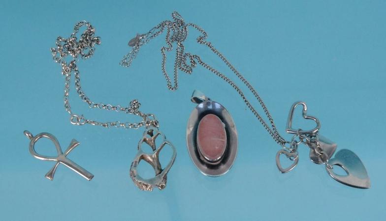Four stylish silver pendants and two silver necklaces, approximate weight 51.5g : FOR CONDITION