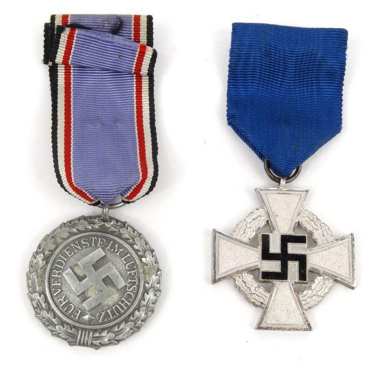 Two military interest German Nazi medals including a black enamel cross : FOR CONDITION REPORTS AND