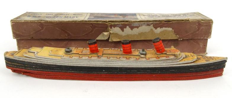 Chad Valley RMS Queen Mary liner puzzle with removable decks, housed in a cardboard box, 30cm