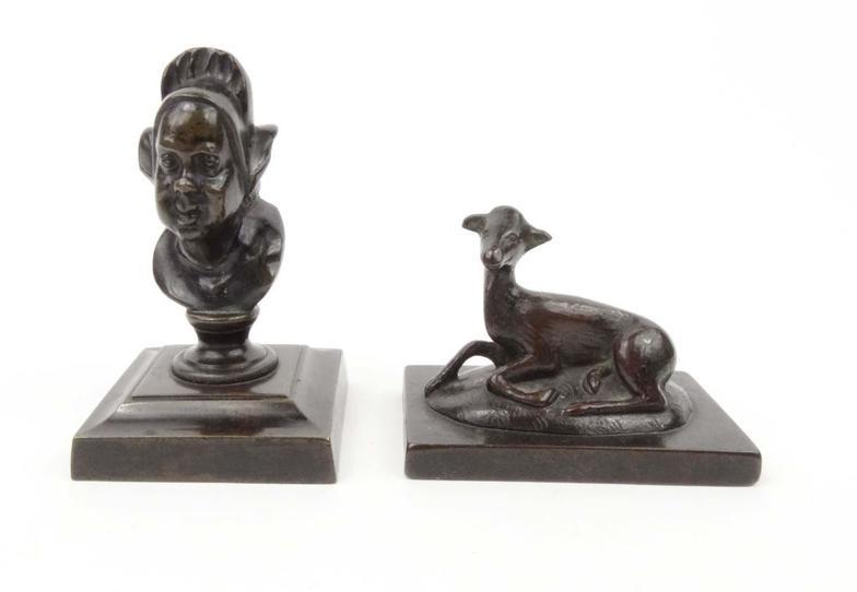 Two small bronze paperweights - one modelled as a baby lamb, the other a bust of a Dutch lady, 11cm