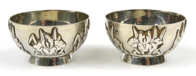 Pair of Chinese silver salts with floral decoration, impressed marks to the base and stamped LH95,
