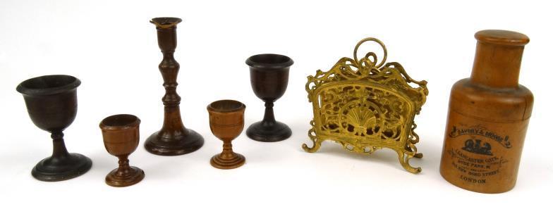Continental gilt metal letter rack, together with a turned treen bottle case, goblets and