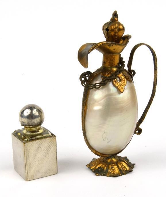 Two Continental scent bottles - one of urn form, the other a square based example with engine