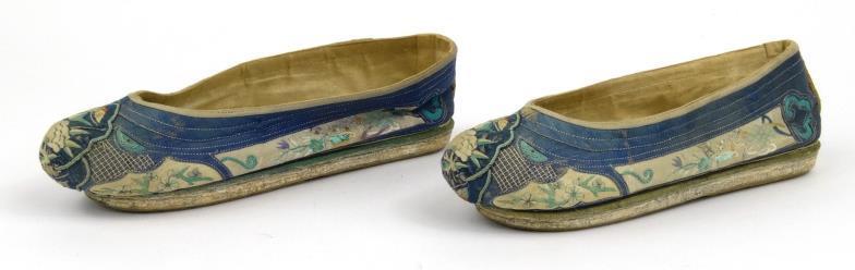 Pair of Chinese cloth slippers, embroidered with flowers, foliage and butterflies, 24cm in length :