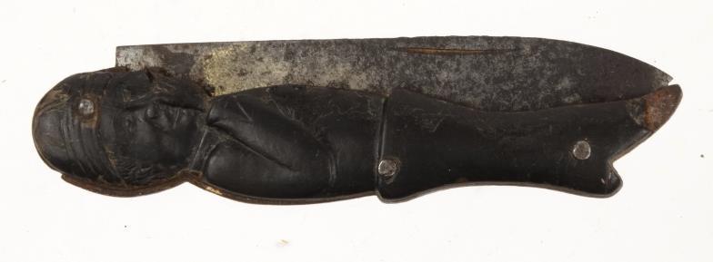 Military interest French/German steel bladed satirical pocket knife, carved with figural flanks,