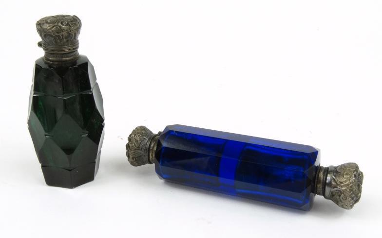 Two Victorian cut glass scent bottles - one blue, one green, each with embossed metal end caps, the