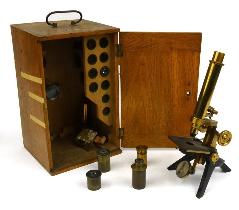 Brass Davon microscope by F. Davidson and Co of London, together with an assortment of spare lenses