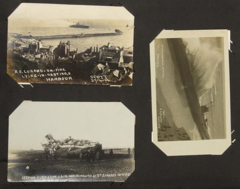 Two albums of postcards including World War I embroidered and topographical cards showing bomb