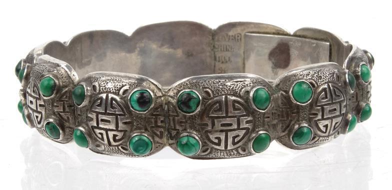 Chinese silver coloured metal bangle decorated with green malachite style stones and engraved
