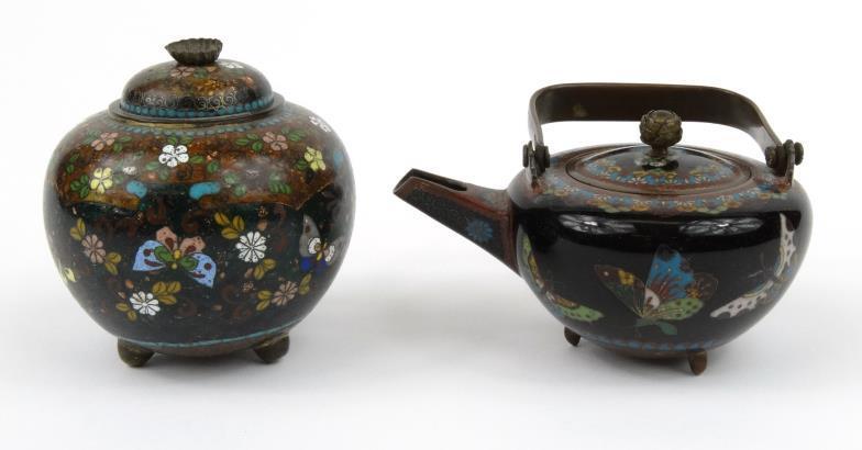 Oriental cloisonné teapot and similar jar and cover, each enamelled with flowers and butterflies,