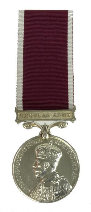 George V British military Long Service and Good Conduct Regular Army medal marked 1853683 W.O.CL11.