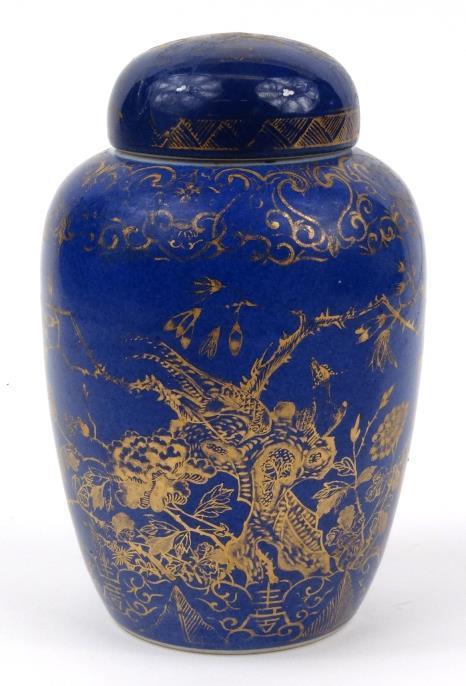 Chinese porcelain jar and cover decorated with a blue glaze and later gilded with flowers, 19cm