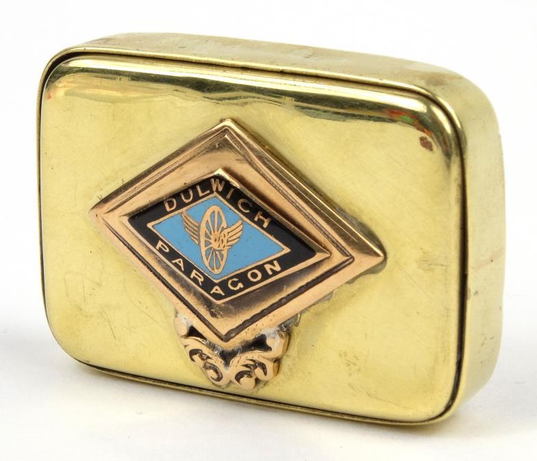 Rectangular brass trick opening vesta set to either side with a gold coloured metal and enamel