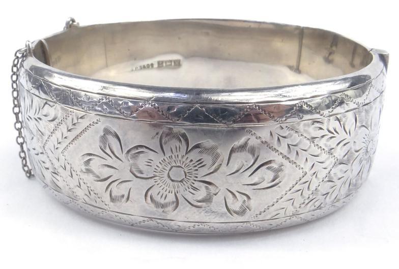 Large silver bangle with floral chased decoration Birmingham hallmarked 2.5cm wide approximate