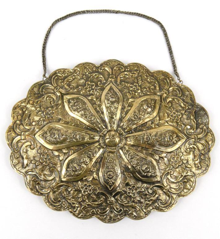 Middle Eastern oval modesty mirror with embossed silver gilt coloured metal frame impressed `900`