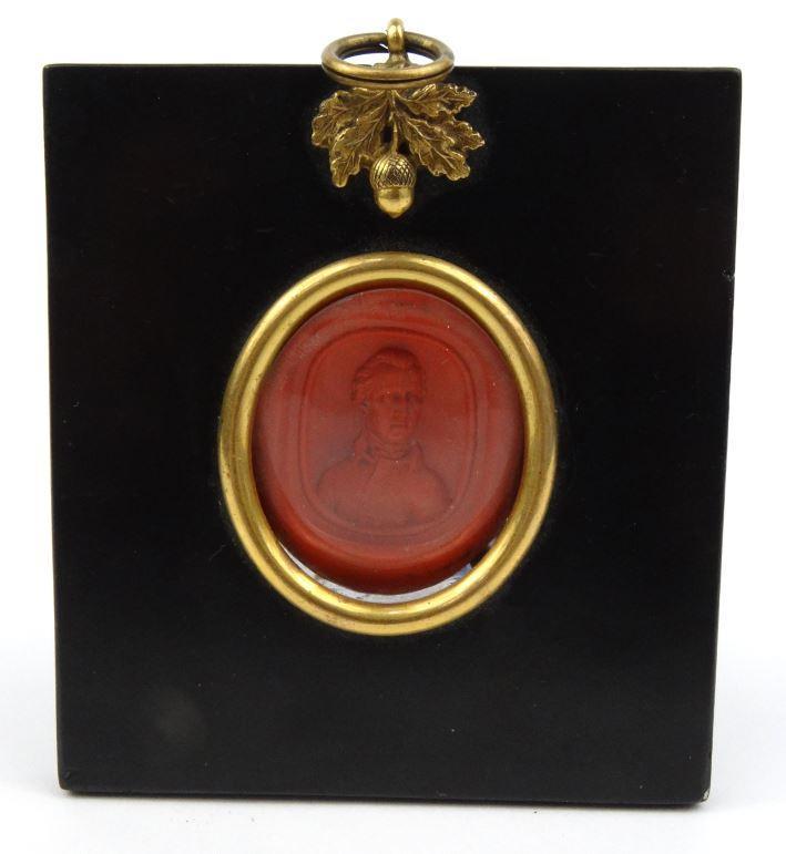 19th Century intaglio wax male portrait seal signed Warwick F. to the border housed in an ebonised