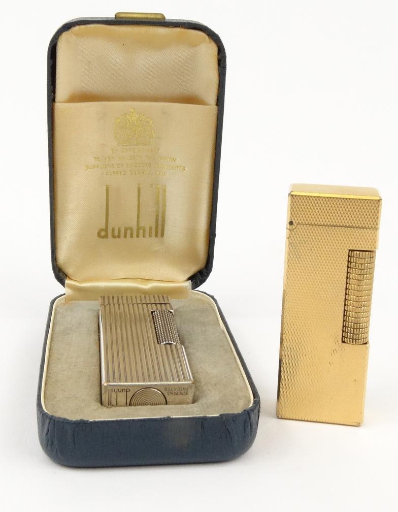 Two Dunhill lighters with fluted and engine turned cases - one with presentation box : FOR